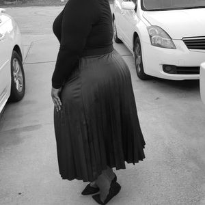 Black pleated “imitation” leather skirt